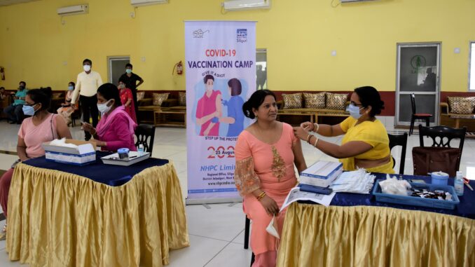 Women getting vaccinated in vaccination camp_